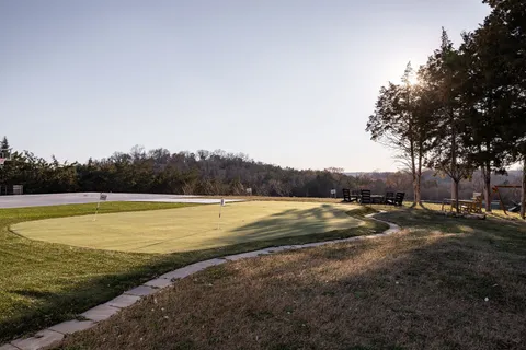 a view of a lake with trees in the background