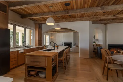 a view of a dining room with furniture and window