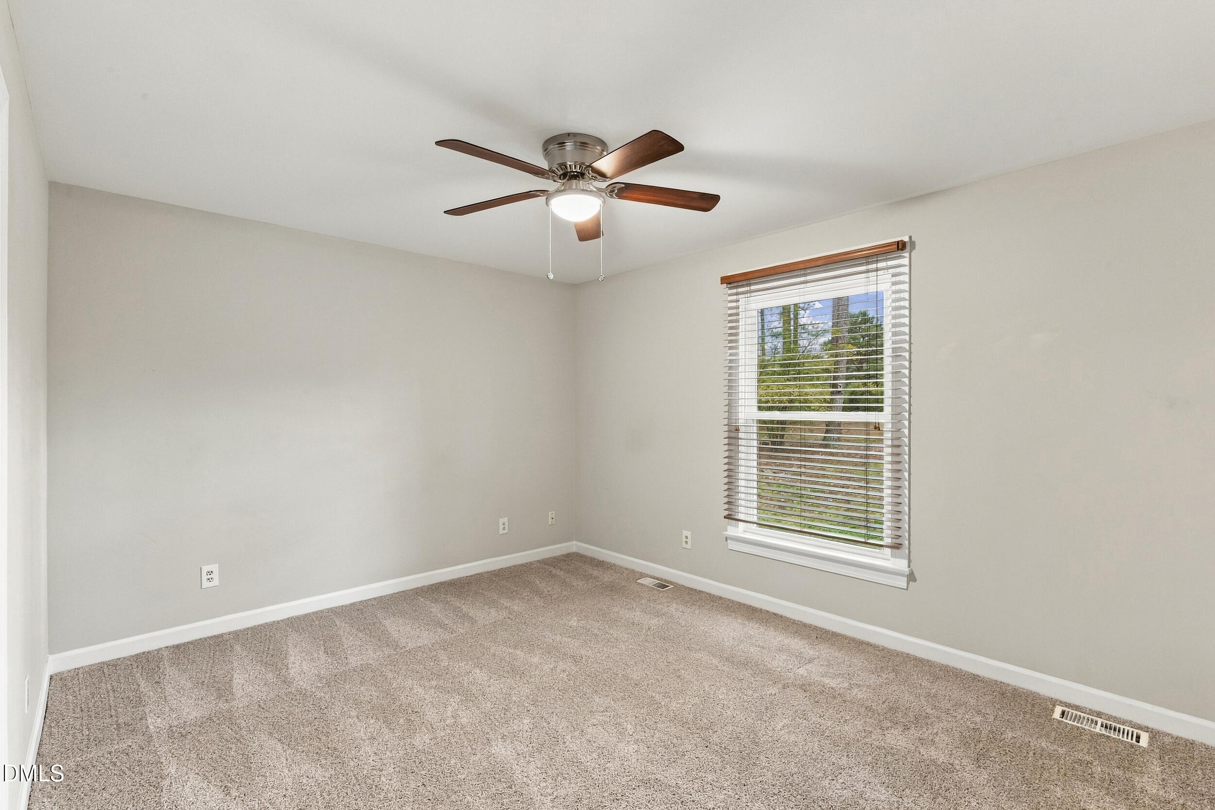 2329 Win Road Garner, NC 27529 - Photo 42 of 90 Neutral wall paint, carpet flooring, a ceiling fan with integrated lighting, and a window with blinds