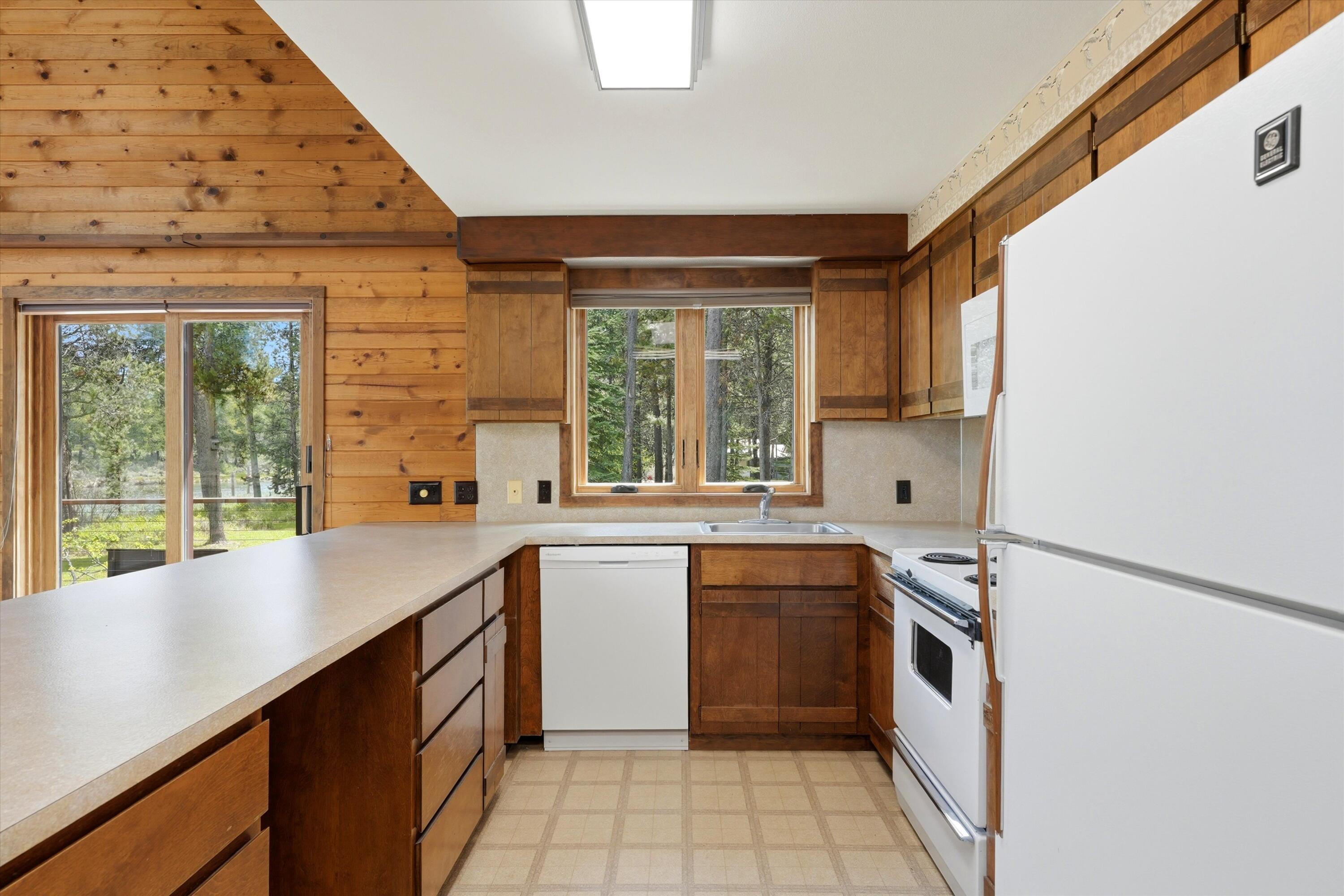 56446 Eclipse Drive Bend, OR 97707 - Photo 17 of 42 a kitchen with a sink stove and cabinets