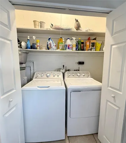 a utility room with washer and dryer