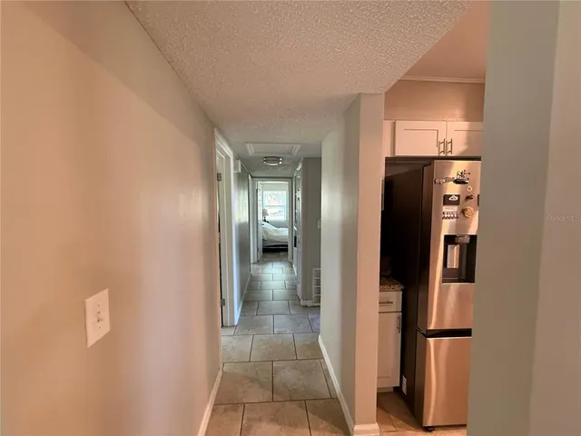 a view of a kitchen from the hallway