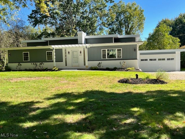 815 Sugar Road Akron, OH 44321 - Photo 1 of 22 Split-style home featuring a front pergola, lawn and a over-sized garage
