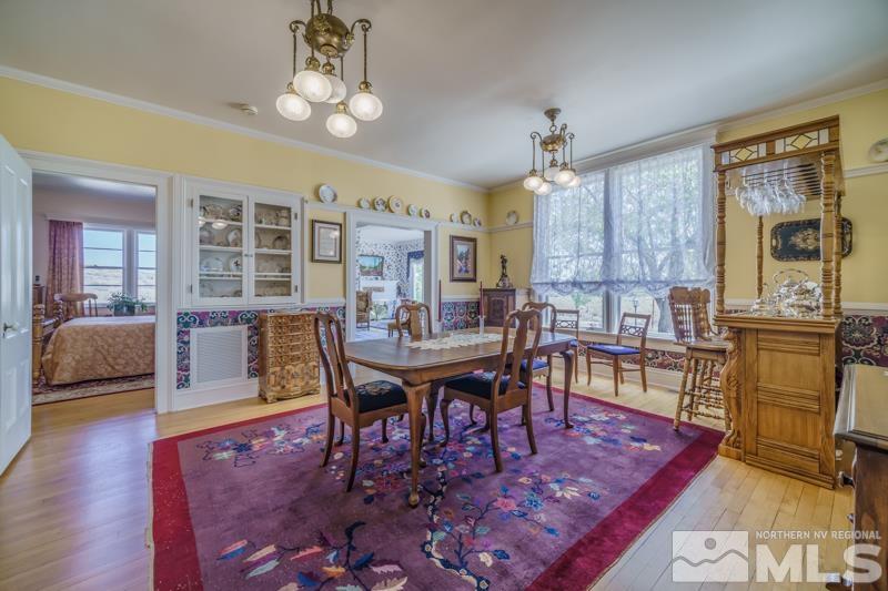 727 Highway 339 Yerington, NV 89447 - Photo 23 of 36 a view of a dining room with furniture and wooden floor