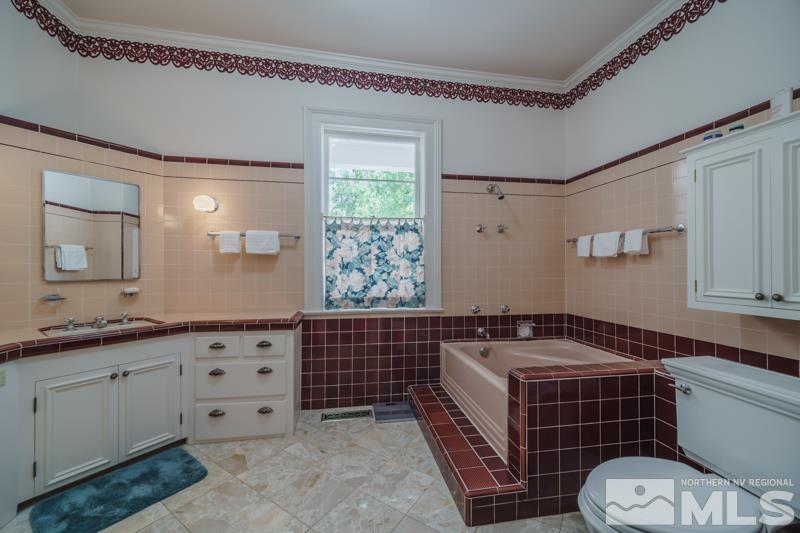 727 Highway 339 Yerington, NV 89447 - Photo 24 of 36 a bathroom with a sink a toilet and mirror