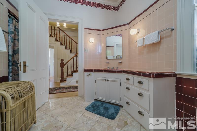 727 Highway 339 Yerington, NV 89447 - Photo 25 of 36 a bathroom with a sink and mirror