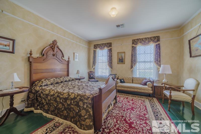 727 Highway 339 Yerington, NV 89447 - Photo 29 of 36 a bedroom with a bed and a couch