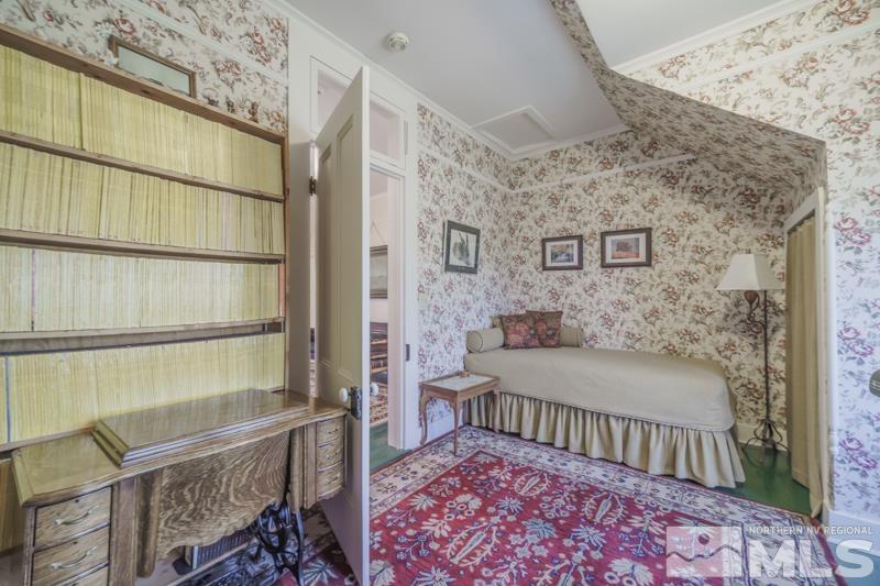 727 Highway 339 Yerington, NV 89447 - Photo 30 of 36 a bedroom with a bed and a table