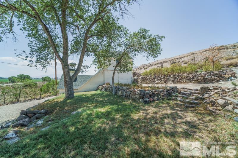 727 Highway 339 Yerington, NV 89447 - Photo 34 of 36 a view of a garden with a tree