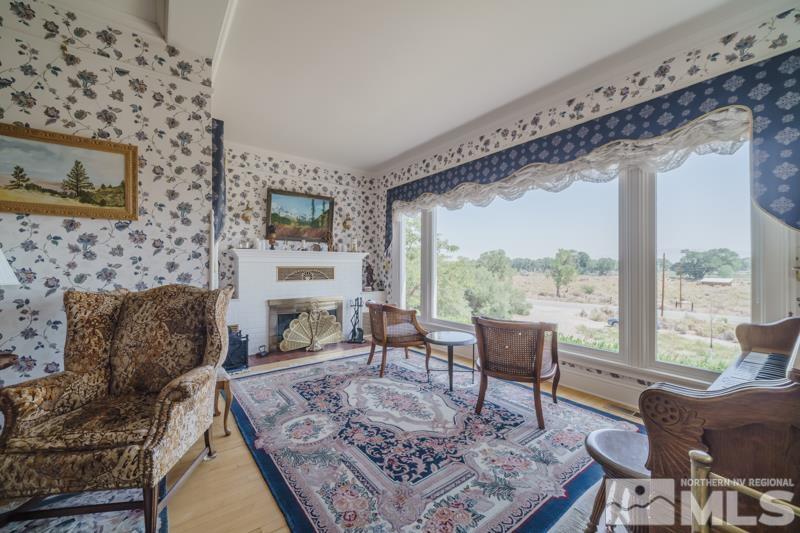 727 Highway 339 Yerington, NV 89447 - Photo 5 of 36 a living room with furniture and a fireplace
