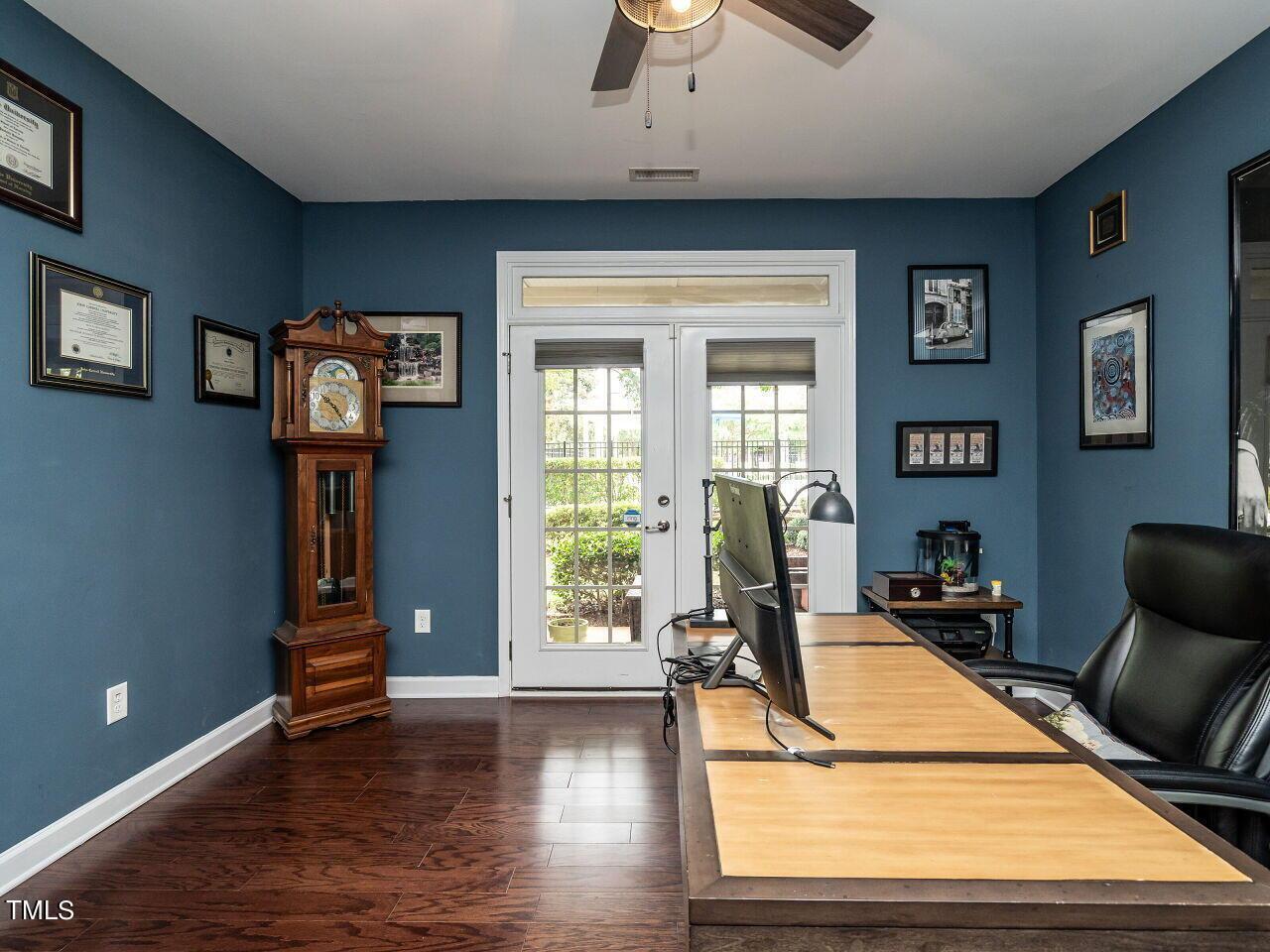 1316 Cornell Place Raleigh, NC 27607 - Photo 25 of 31 a room with gym equipment and wooden floor