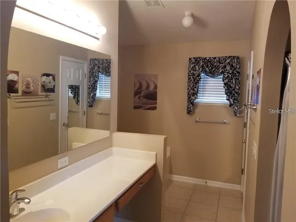 a bathroom with a bathtub and a sink