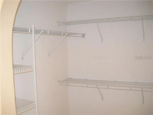 a view of a room with racks on the wall