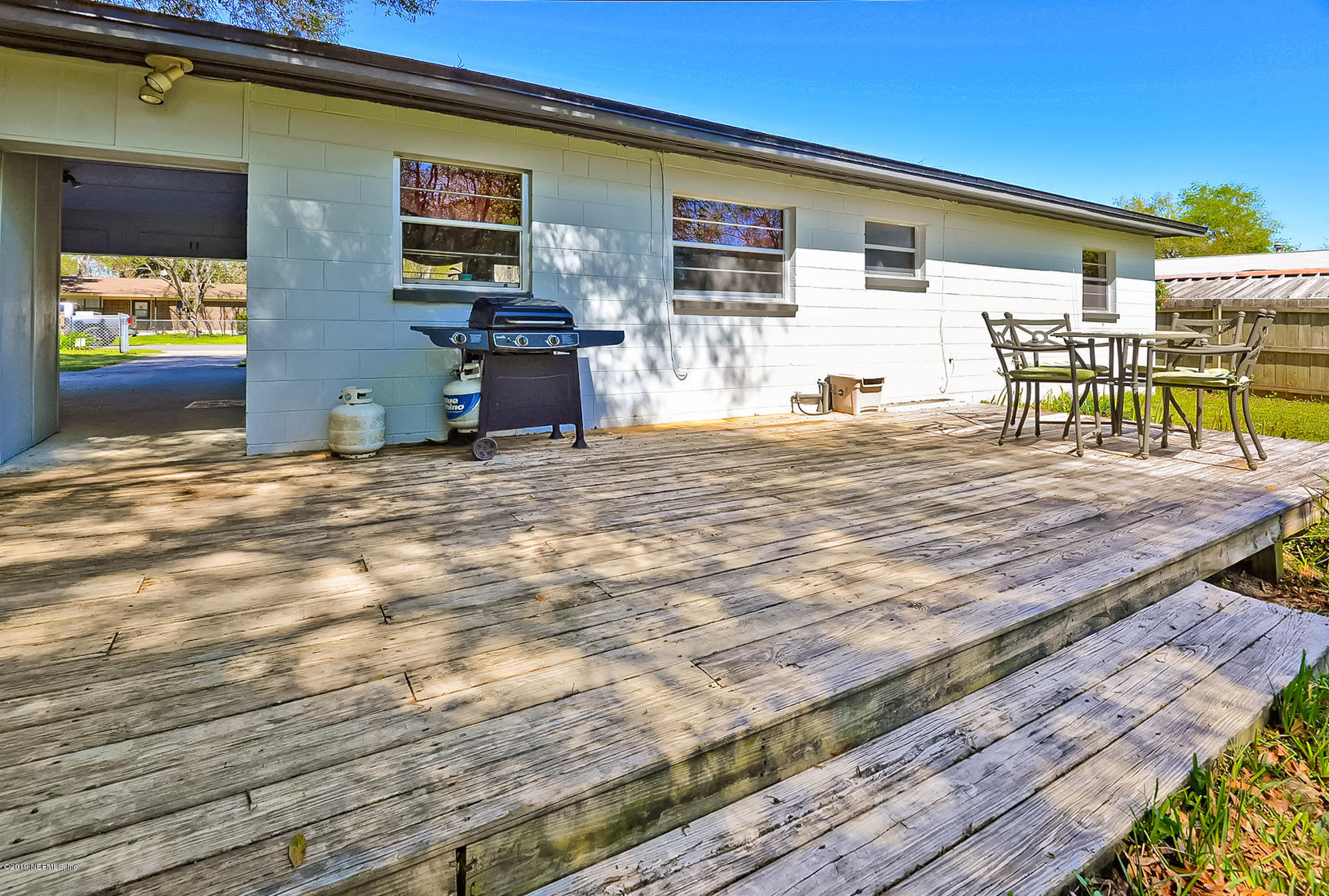 7442 Melvin Road Jacksonville, FL 32210 - Photo 16 of 17 a view of a house with backyard