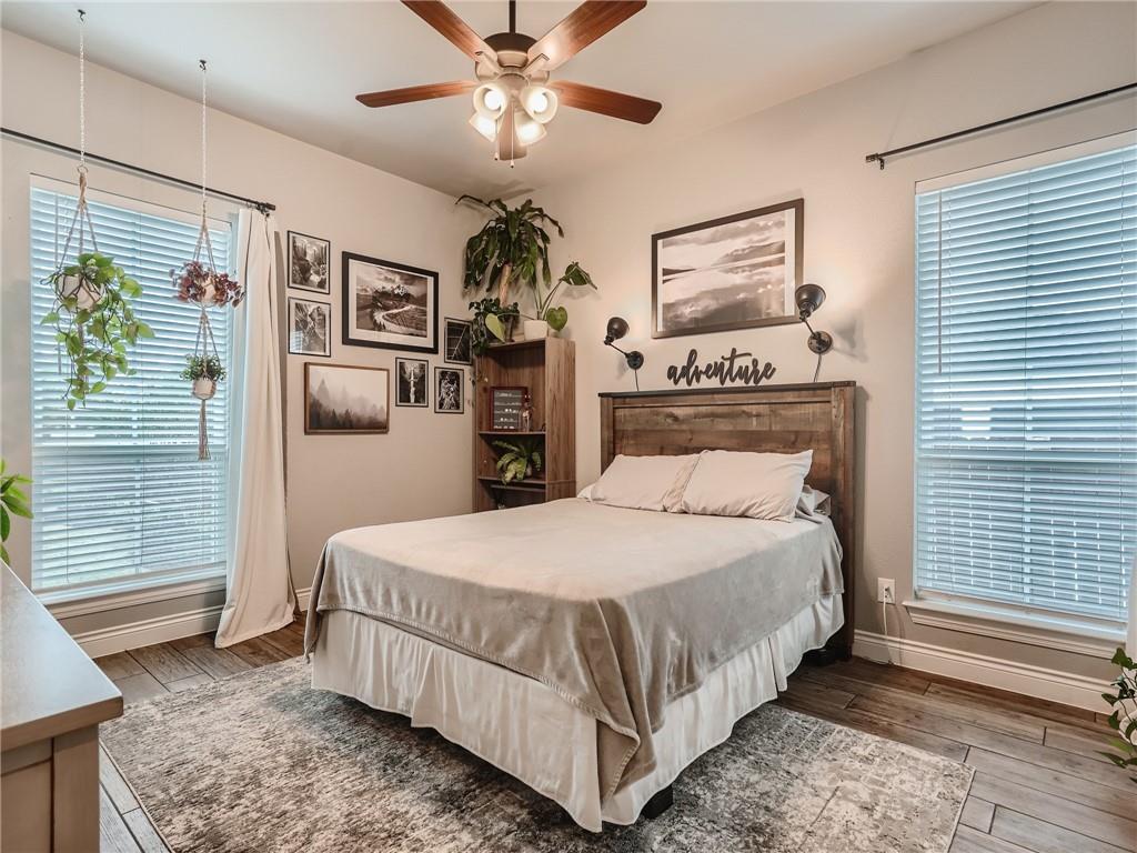 132 Huerta Road Florence, TX 76527 - Photo 20 of 40 Hardwood floors and a ceiling fan enhance this cozy, well-lit sleeping area.
