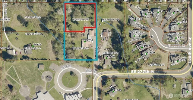 an aerial view of residential house with outdoor space and swimming pool