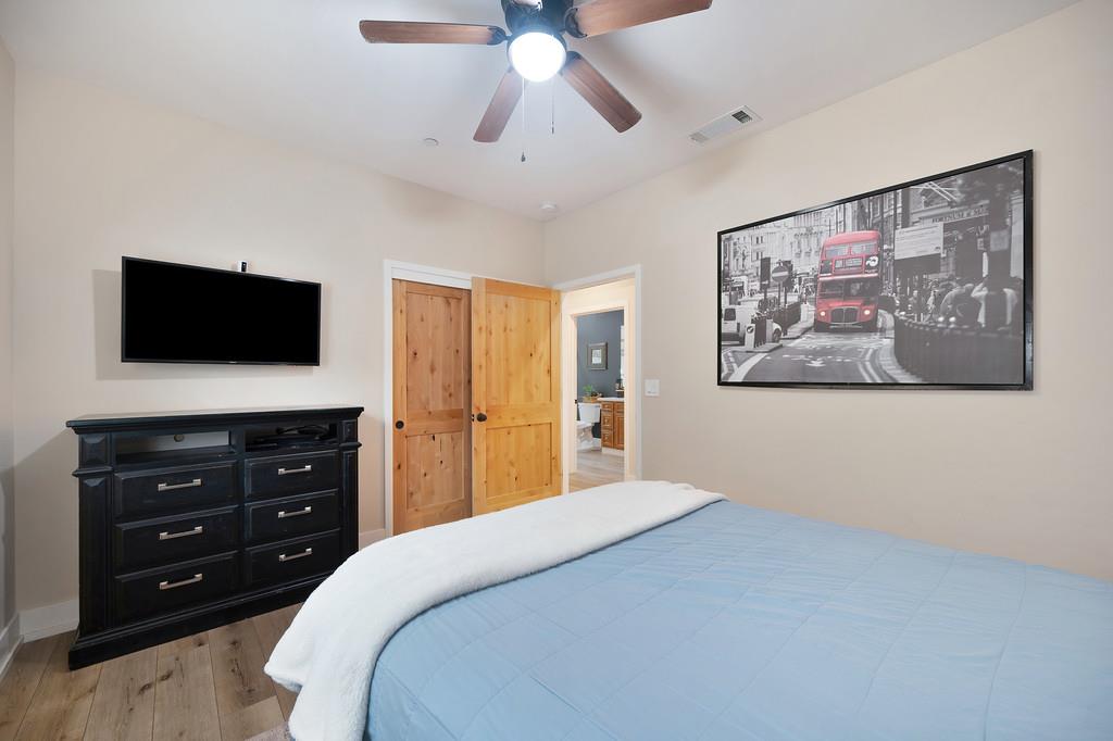 3960 Fort Jim Road Placerville, CA 95667 - Photo 28 of 64 a bedroom with a bed and a flat screen tv