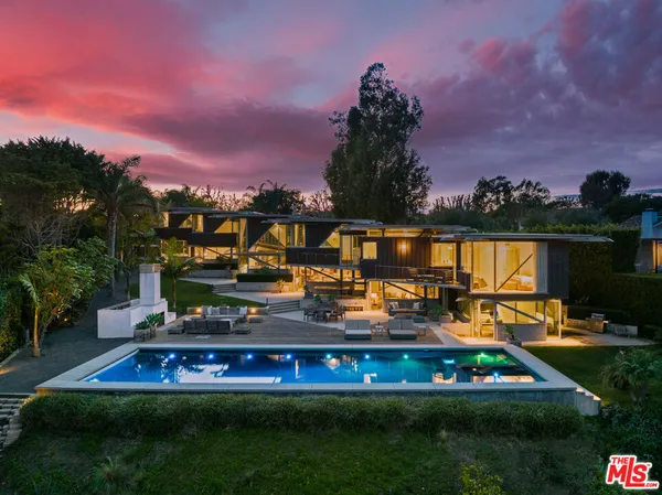 a view of swimming pool with outdoor seating