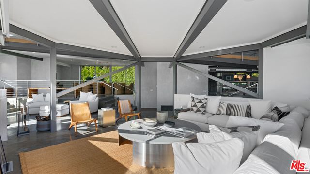 a room with furniture and a potted plant