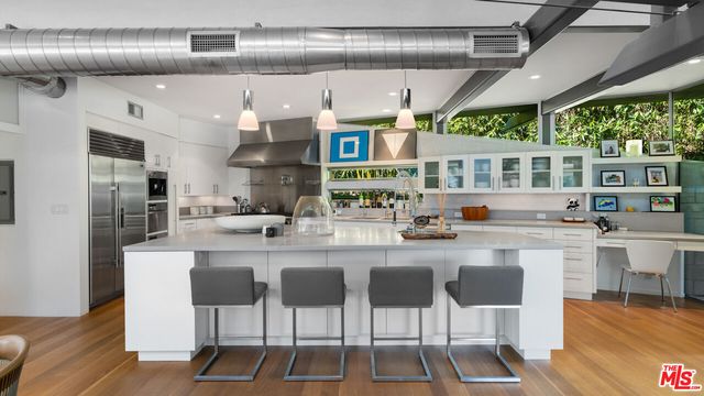 a kitchen with counter space and breakfast area