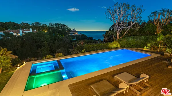 a view of swimming pool with a yard