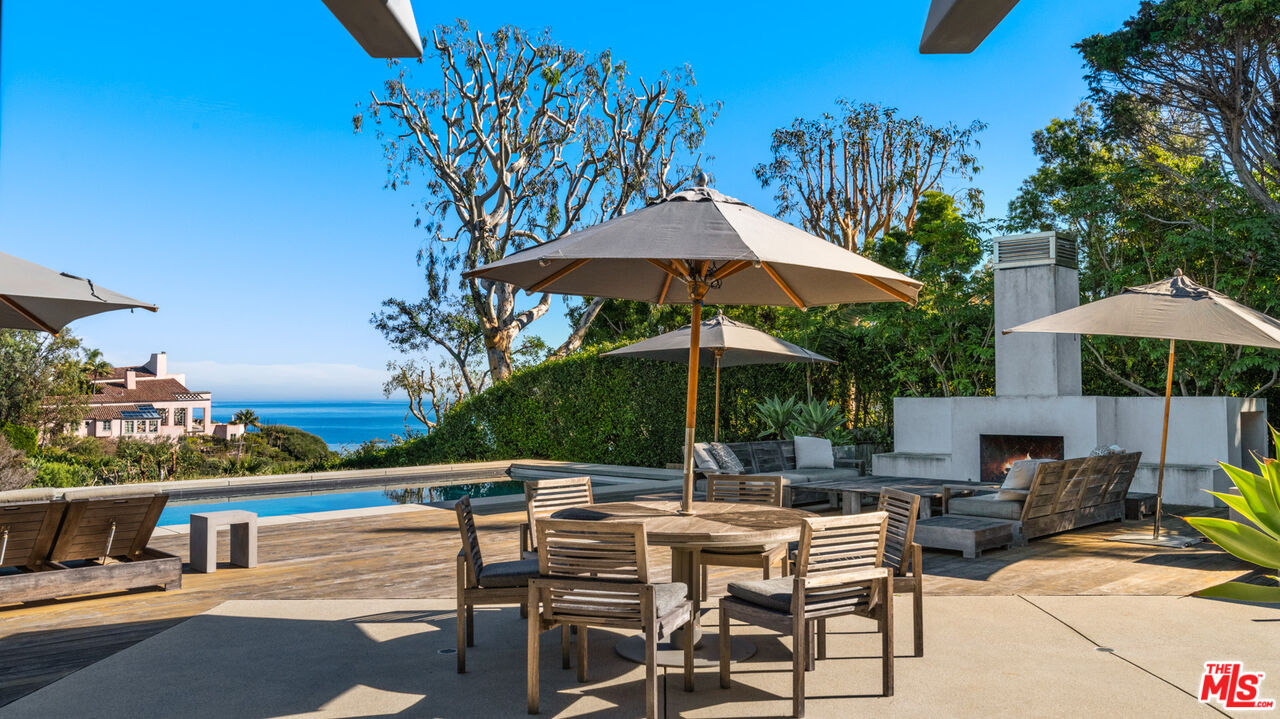28827 Grayfox Street Malibu, CA 90265 - Photo 44 of 60 an outdoor space with patio and white umbrellas