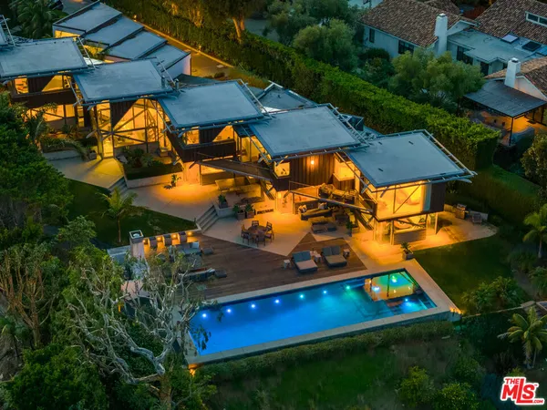 a view of building with a swimming pool