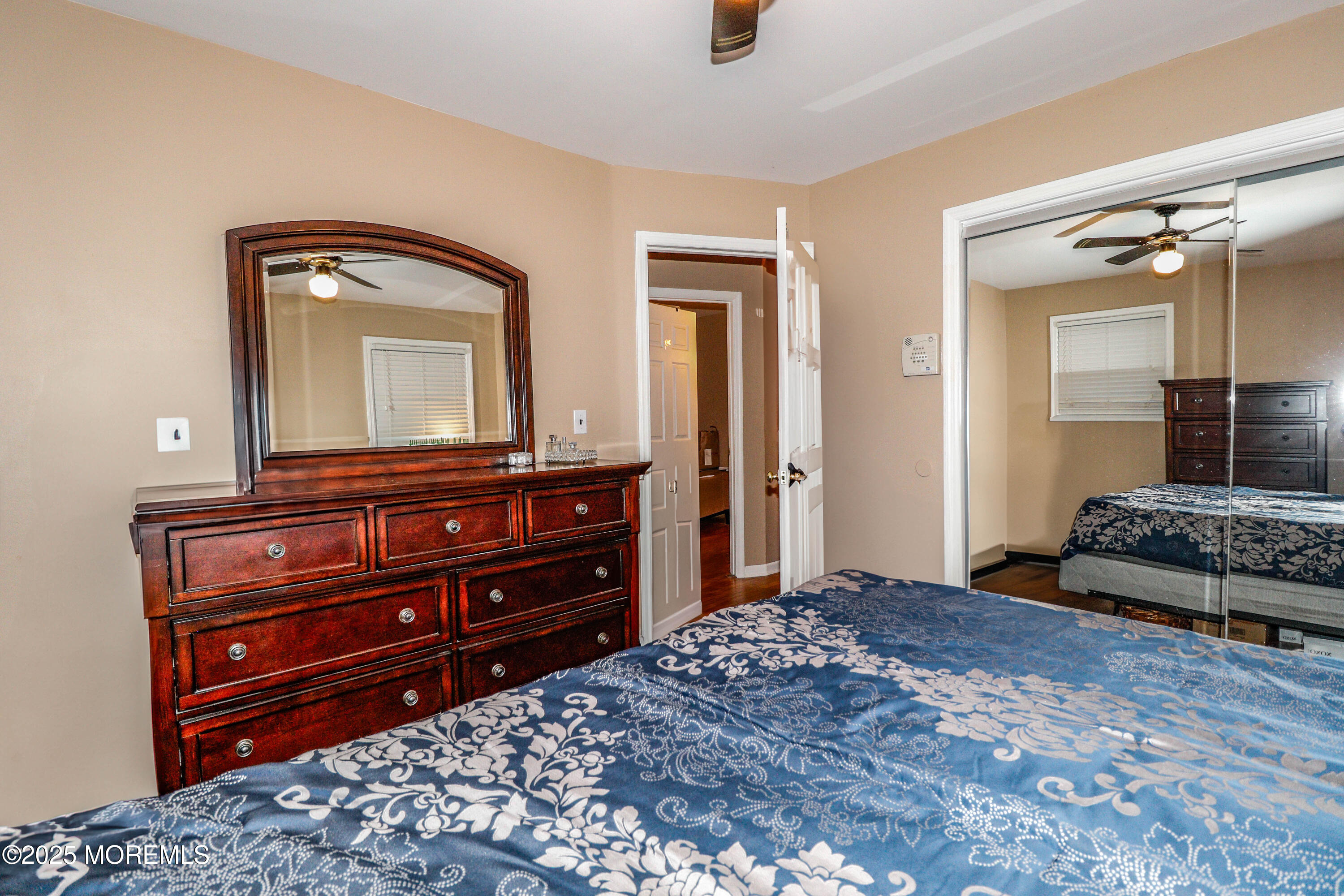7 Alan Terrace Jackson, NJ 08527 - Photo 15 of 28 a bedroom with a bed and a mirror on dresser