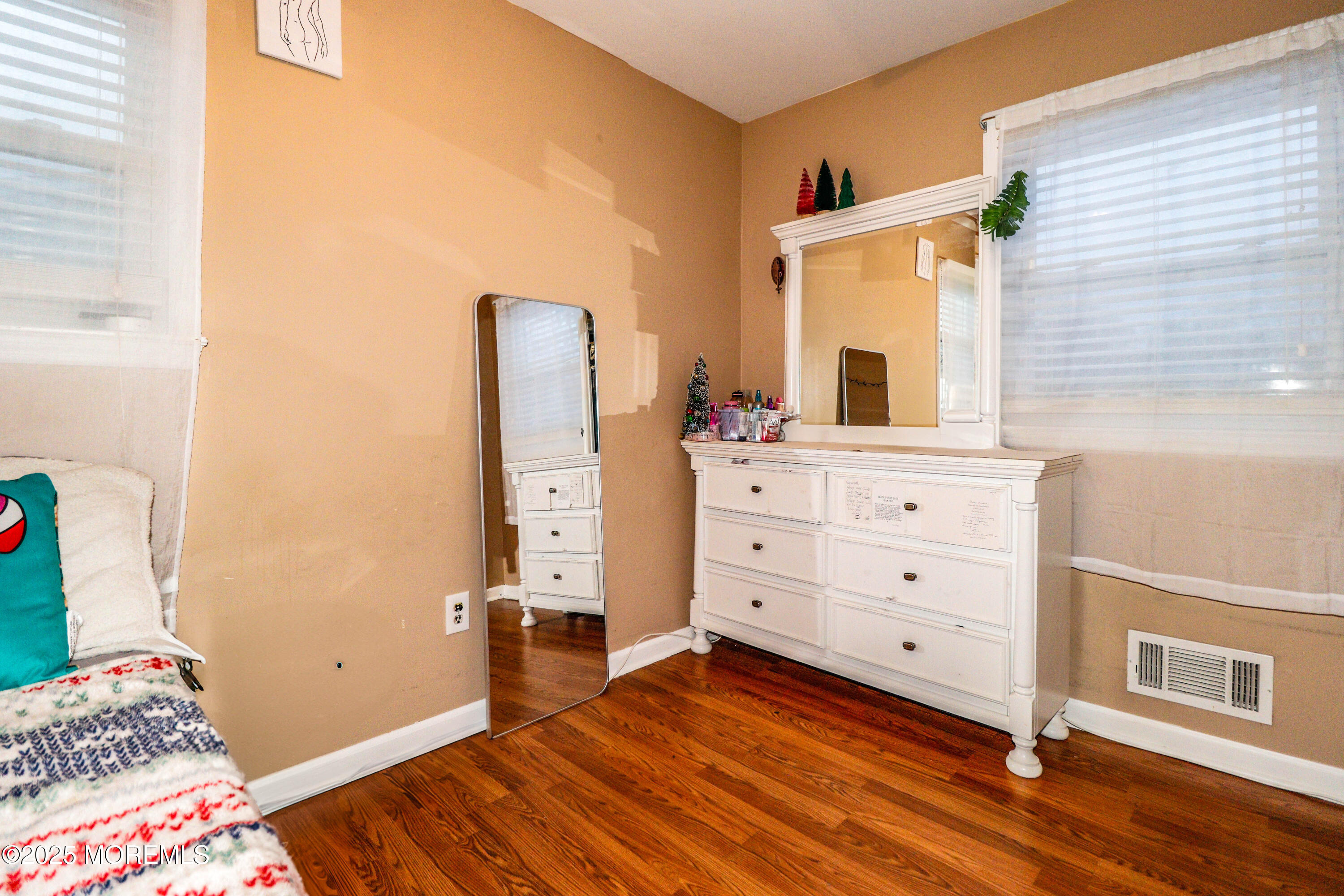 7 Alan Terrace Jackson, NJ 08527 - Photo 16 of 28 a bedroom with a bed and wooden floor