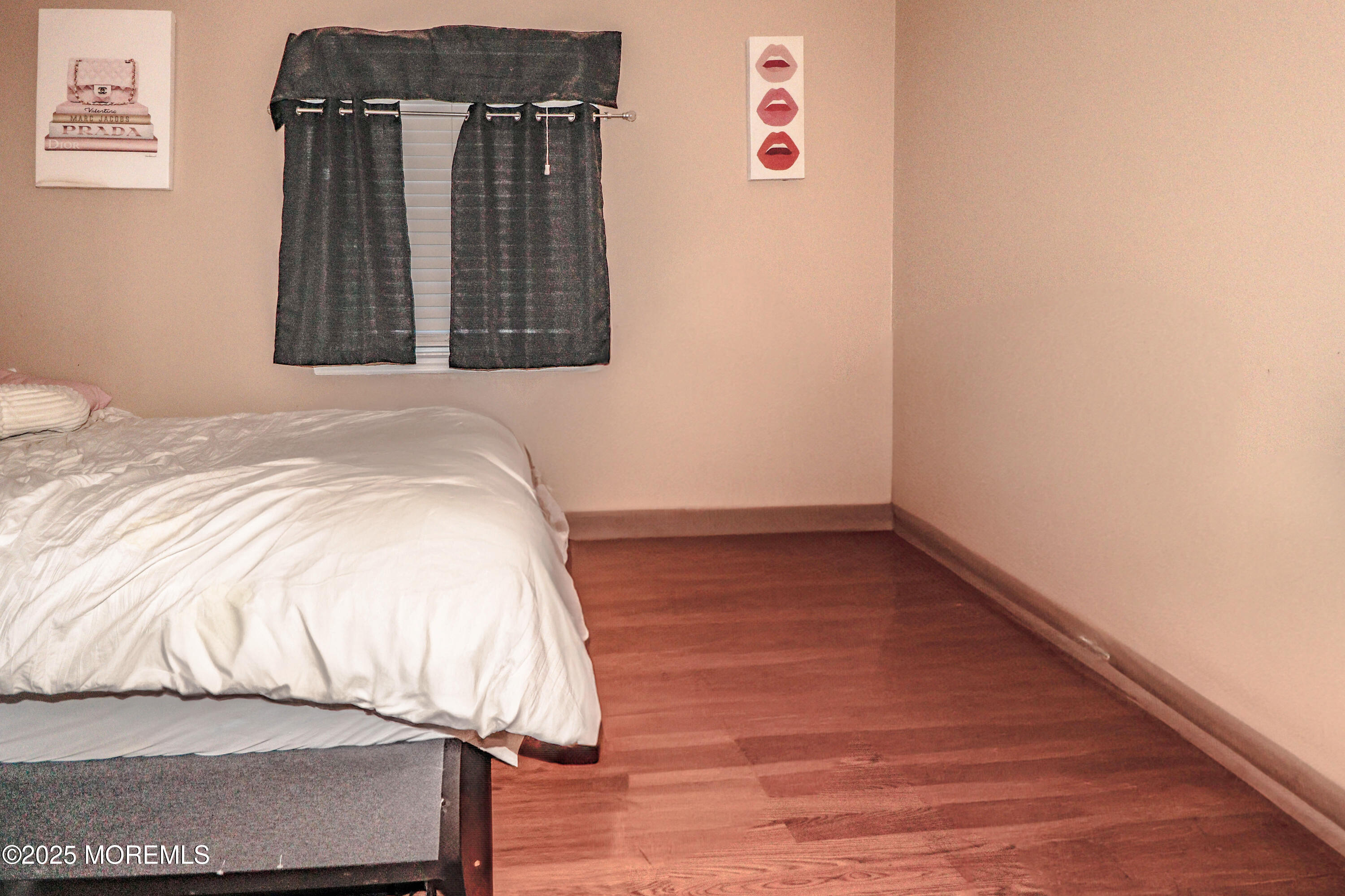 7 Alan Terrace Jackson, NJ 08527 - Photo 18 of 28 a bedroom with a bed and wooden floor