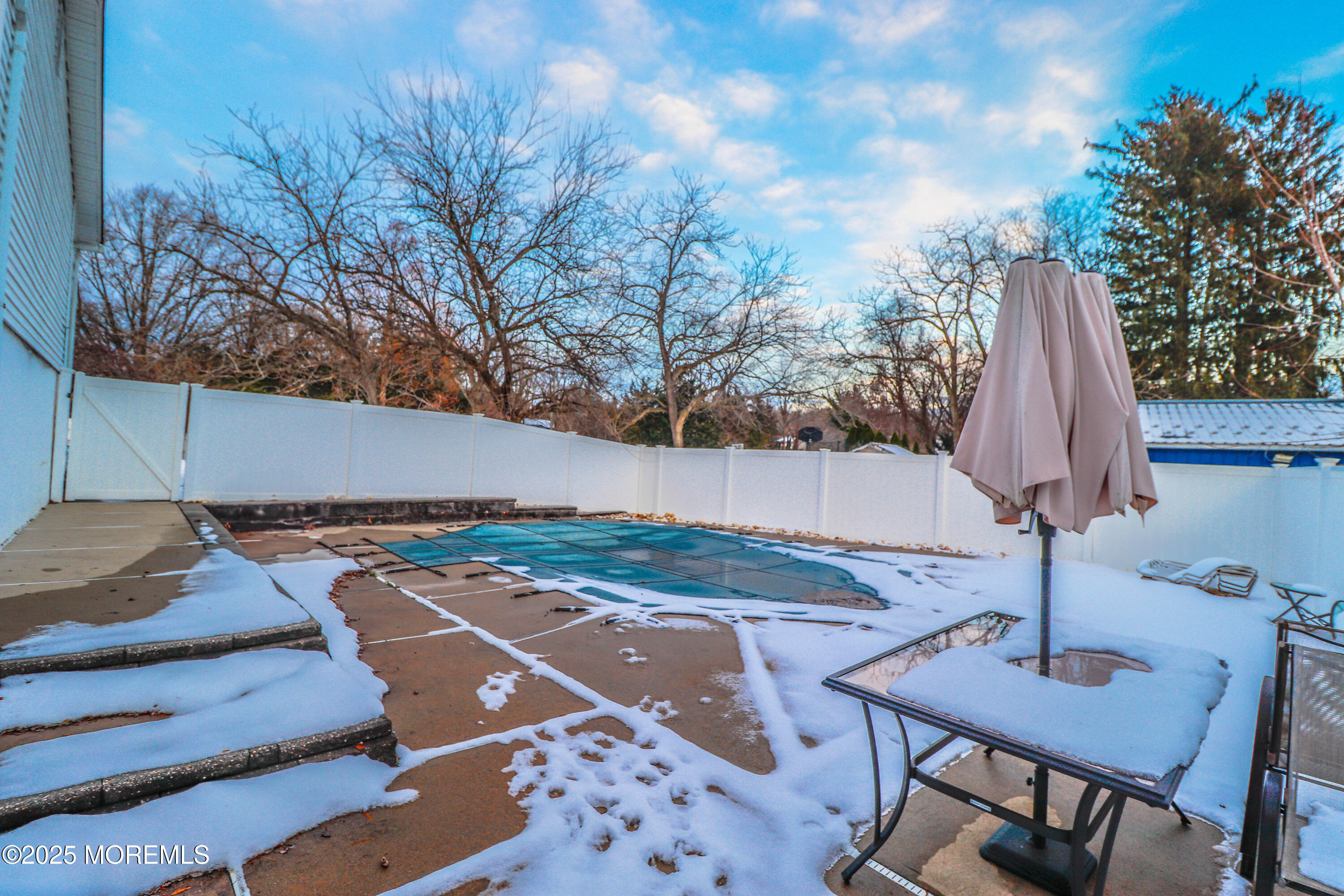 7 Alan Terrace Jackson, NJ 08527 - Photo 24 of 28 a view of backyard with swimming pool and outdoor seating