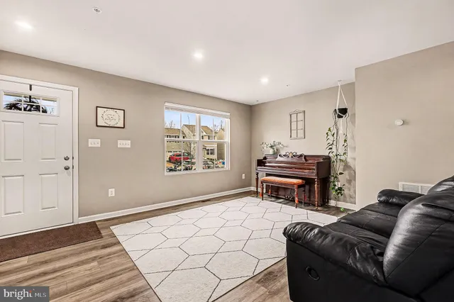 a living room with furniture and a table