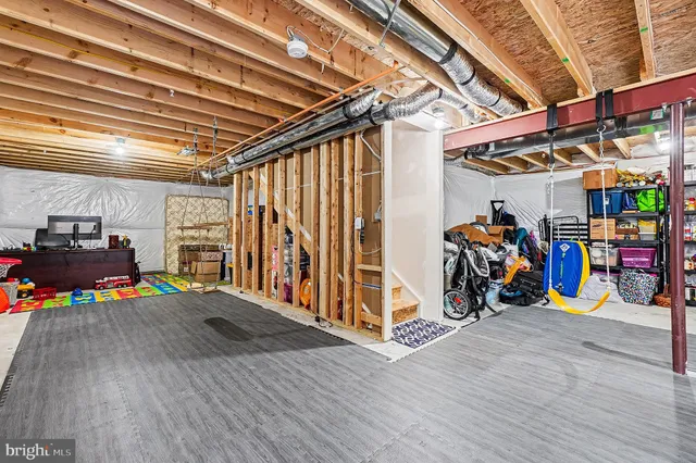 a view of a garage with rack and bicycle