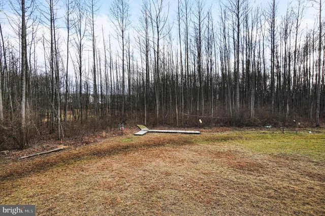 a view of outdoor space with wooden fence