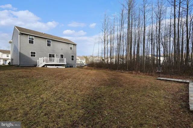 a view of a backyard with sitting area