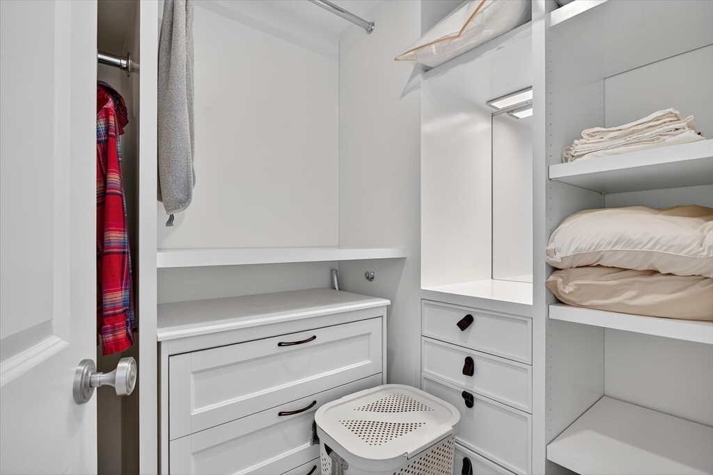 10 Bowdoin Street, Unit 202 Boston, MA 02114 - Photo 13 of 16 a bathroom with a toilet and a shower