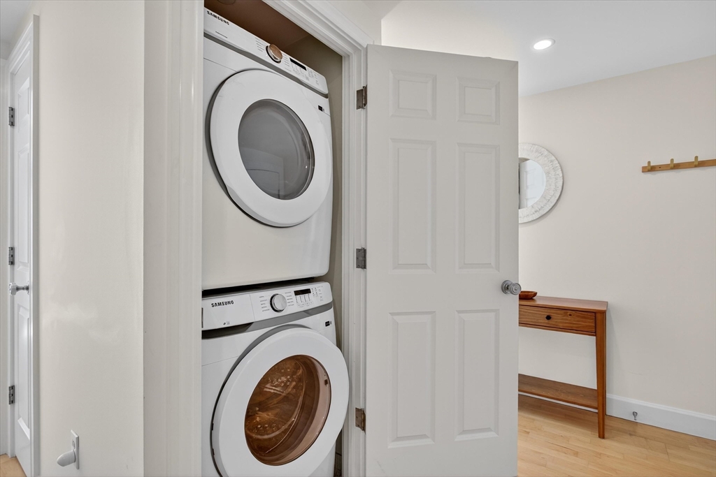 10 Bowdoin Street, Unit 202 Boston, MA 02114 - Photo 9 of 16 a utility room with dryer and washer