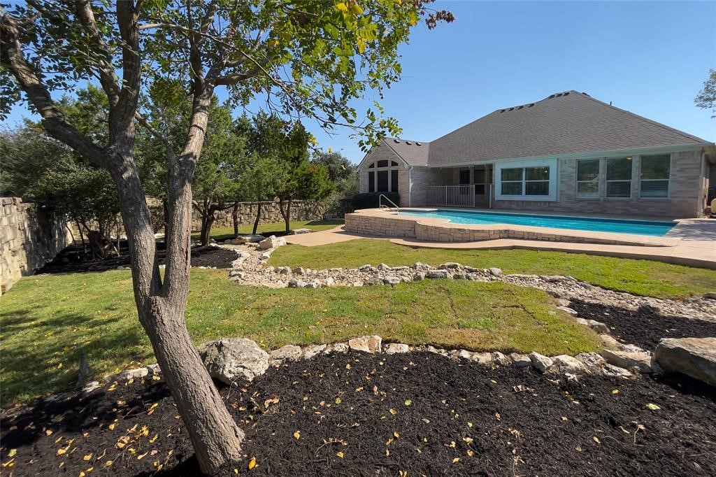 100 Abbey Drive Austin, TX 78737 - Photo 1 of 1 a view of a house with a yard