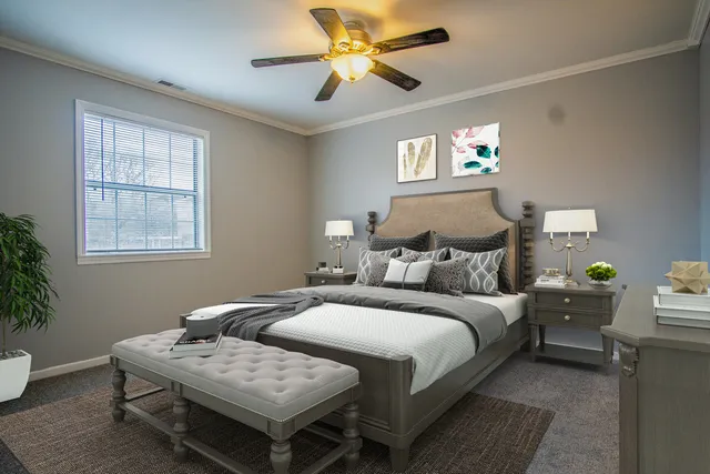 a bedroom with bed and a window