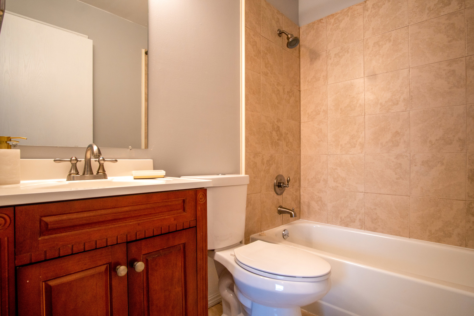 15 Gant Circle, Unit E Streamwood, IL 60107 - Photo 13 of 21 a bathroom with a sink a toilet and shower