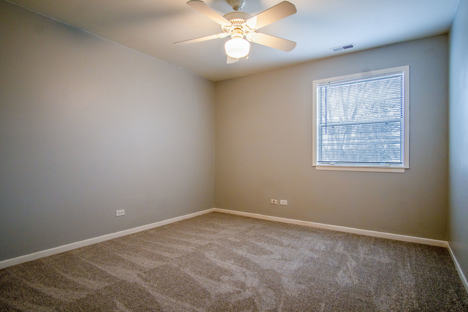 15 Gant Circle, Unit E Streamwood, IL 60107 - Photo 15 of 21 a view of an empty room with a window