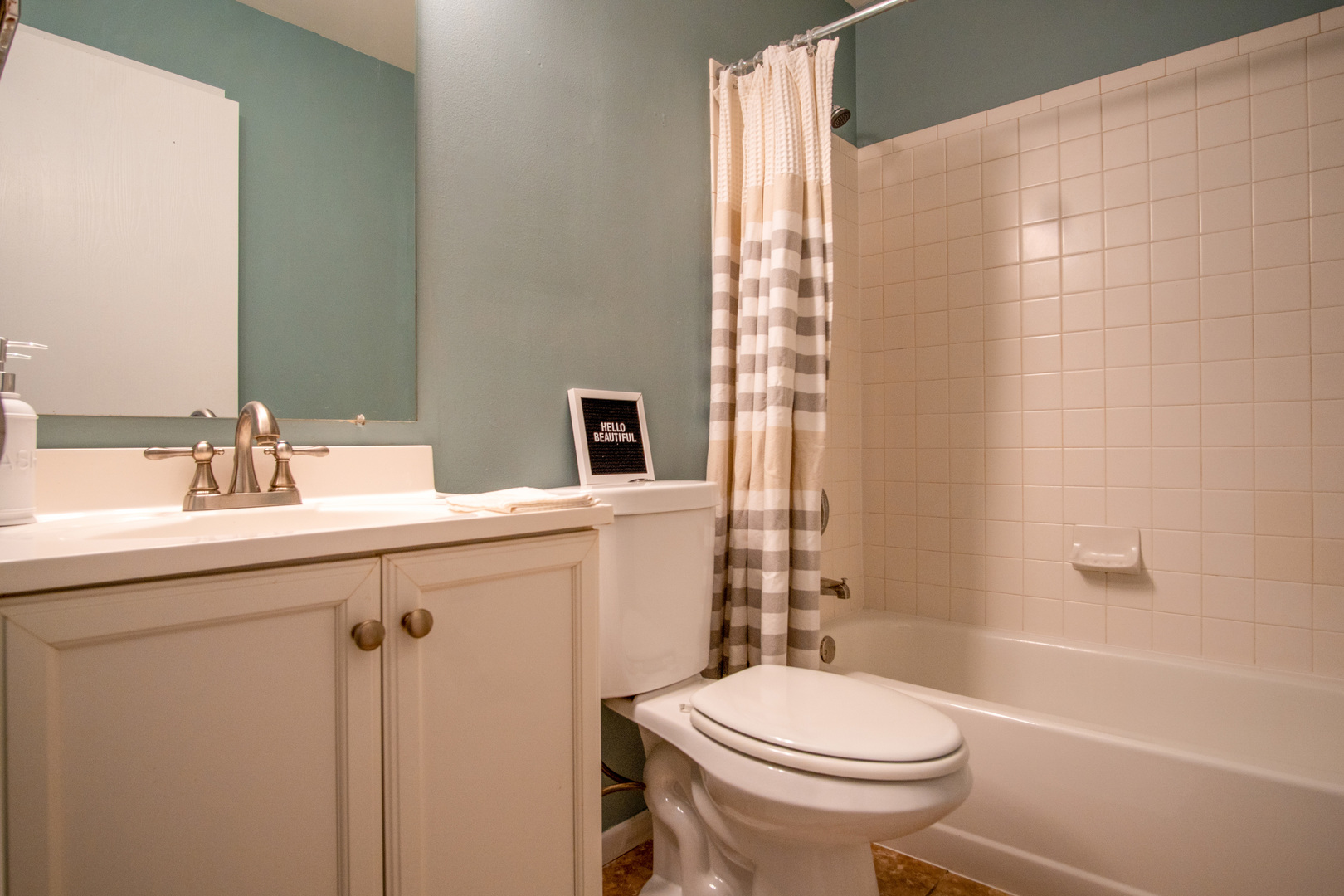 15 Gant Circle, Unit E Streamwood, IL 60107 - Photo 17 of 21 a bathroom with a sink a toilet and shower