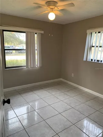 a view of an empty room with a window