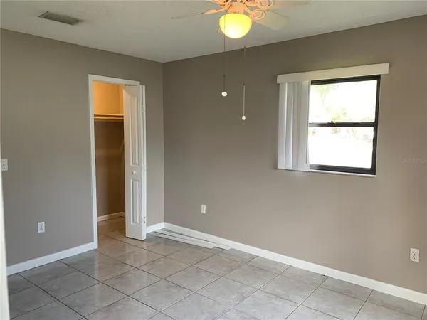 an empty room that has a window