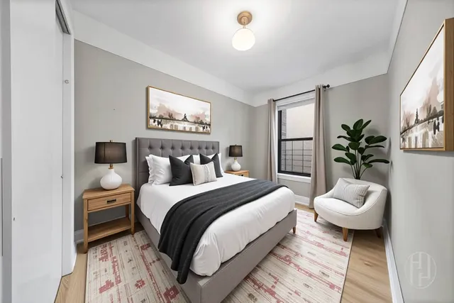 a spacious bedroom with a bed and a window