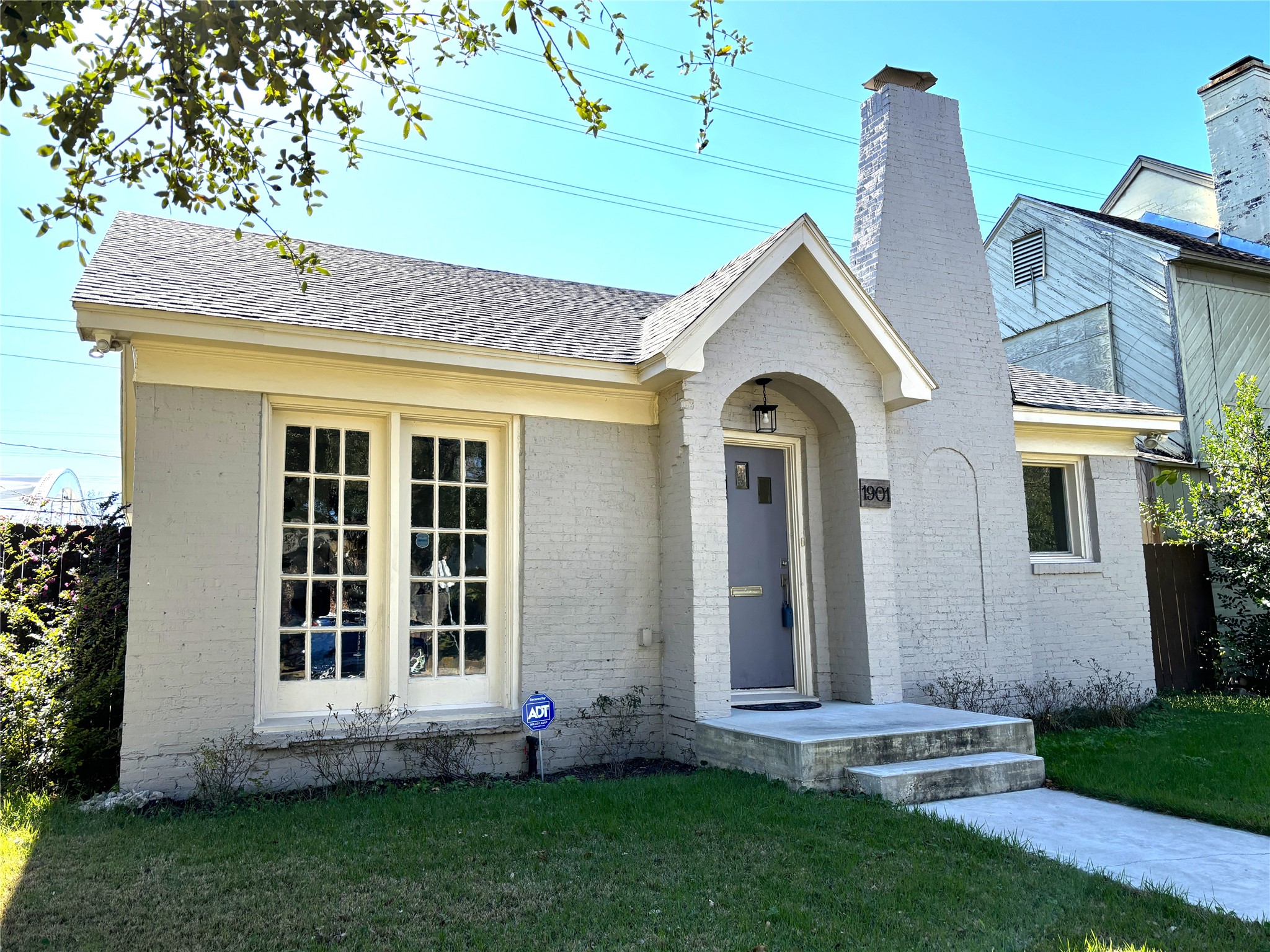 1901 Lexington Street Houston, TX 77098 - Photo 1 of 32 Welcoming front facade features classic brickwork and an arched entry that exudes timeless appeal and warmth.