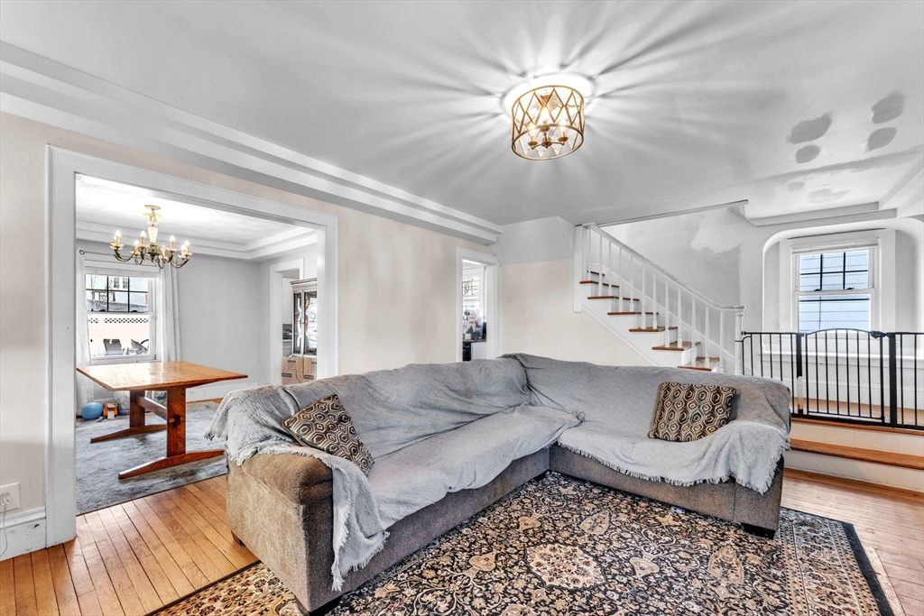 47 Eckington Street Springfield, MA 01108 - Photo 9 of 33 a living room with furniture and a chandelier