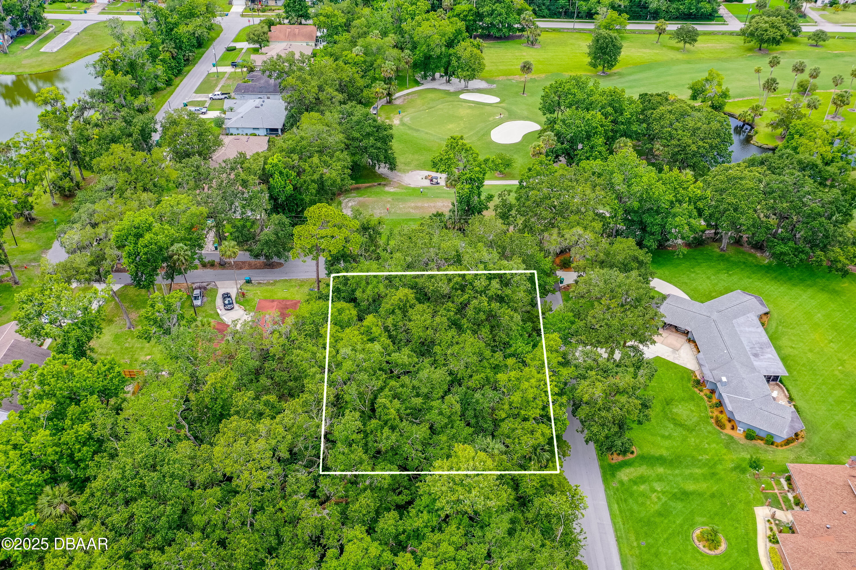 1 Timber Trail Holly Hill, FL 32174 - Photo 4 of 7 a view of a lake with a houses
