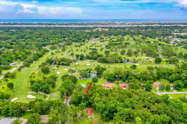 a view of lake with residential houses with outdoor space and swimming pool