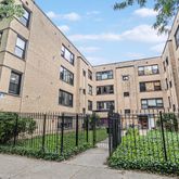 a view of a building with a yard